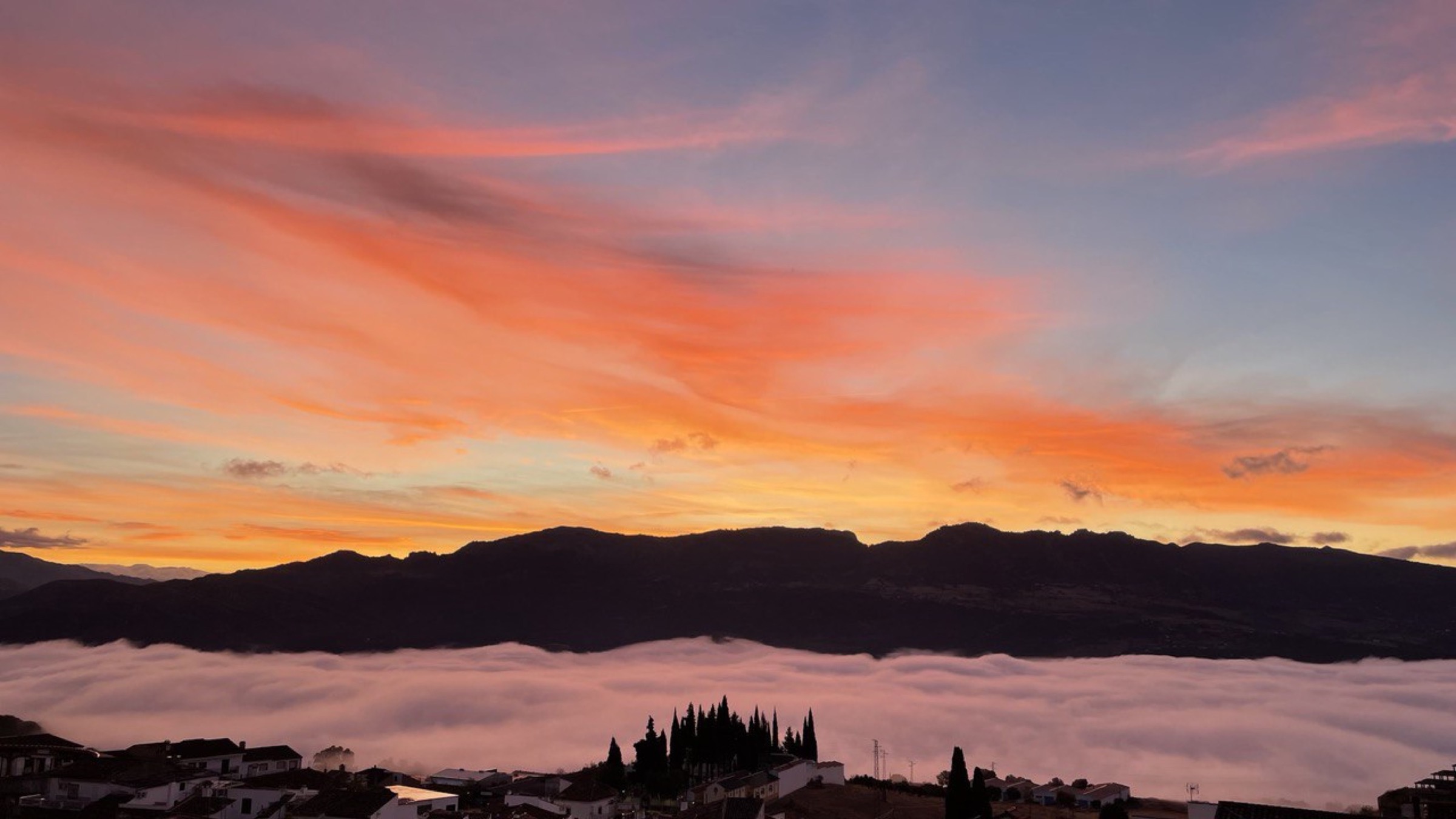 Early morning light spilling across the valley from the terrace